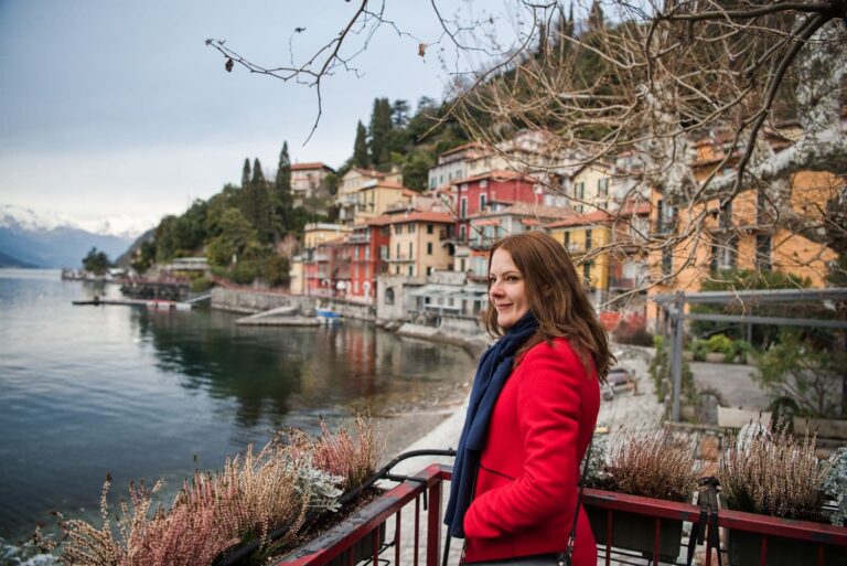 Kristine in Varenna on Lake Como with colourful houses in the background
